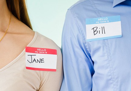 Man and woman wearing name tags, Remember names